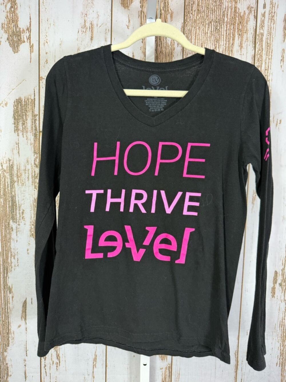 LeVel, Black Long Sleeve V‑Neck Tee with Pink Graphic. Size Medium.